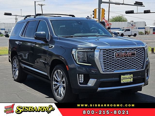 2021 GMC Yukon Denali in Dark Sky Metallic — front three-quarter view